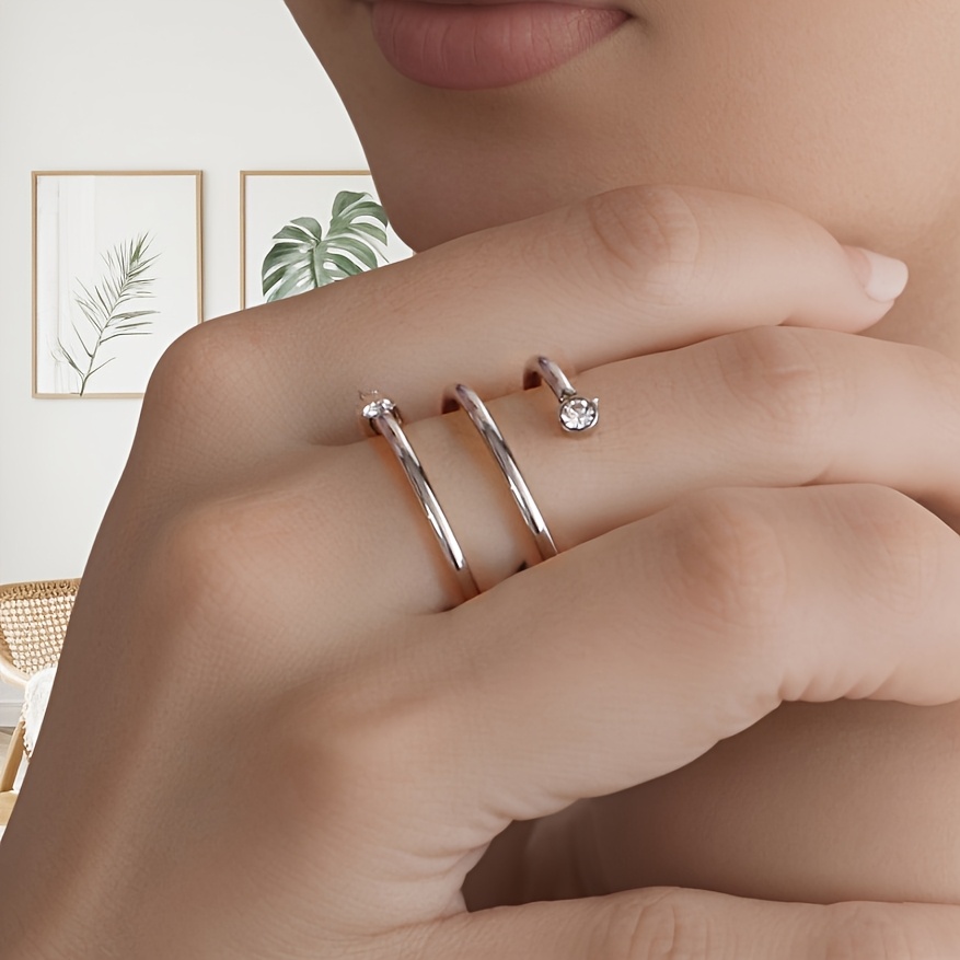 Carnival Stainless Steel Twisted Band Ring with Sparkling Artificial Stone